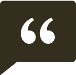 A green quotation mark icon inside a dark speech bubble.